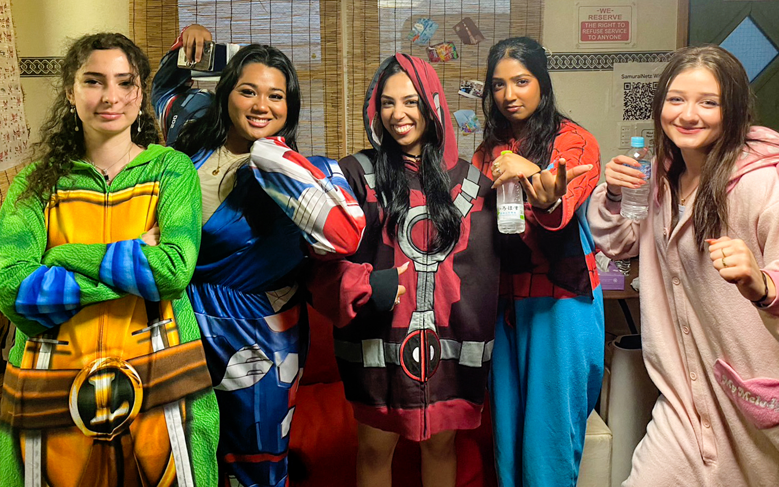 Participants in costume preparing for the 1-Hour Original Street Go-Kart Experience in Osaka Namba.