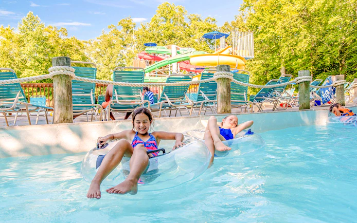 Children enjoying a lazy river ride at Rock and Roll Island, Water Country USA.