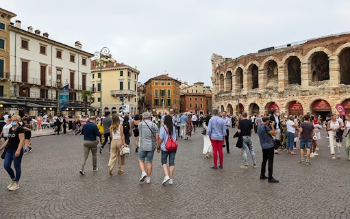 Crowd in Piazza Bra near Verona Arena during guided tour from Lake Garda.