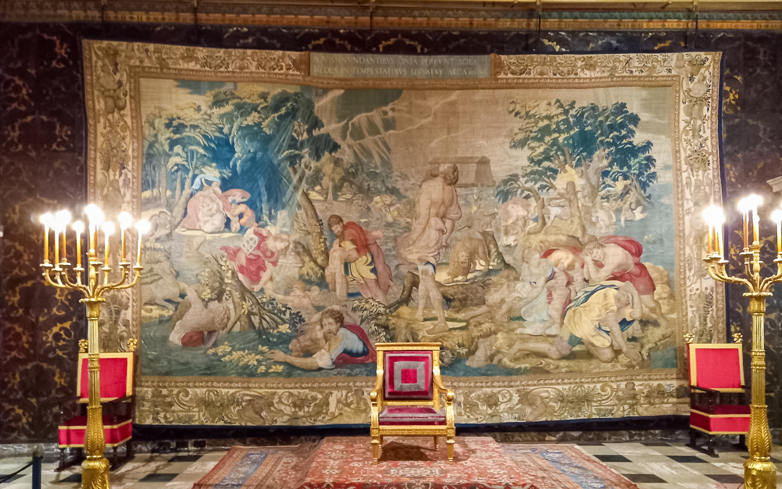 Tapestry and ornate chair in Wawel Castle interior, Krakow, Poland.