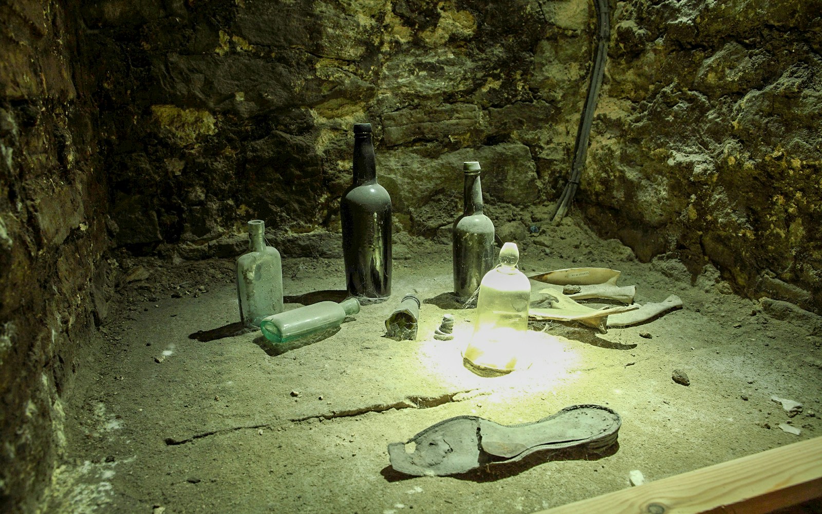 Old bottles and artifacts in Edinburgh's historic underground vaults.