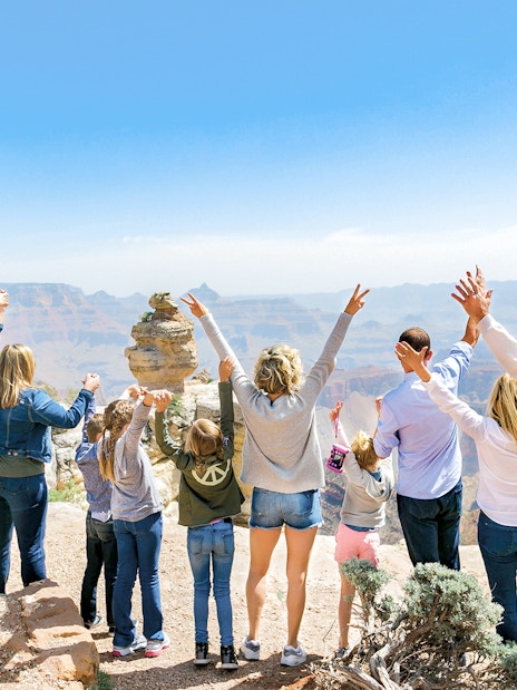 Group enjoying view at Grand Canyon National Park during Hummer tour.