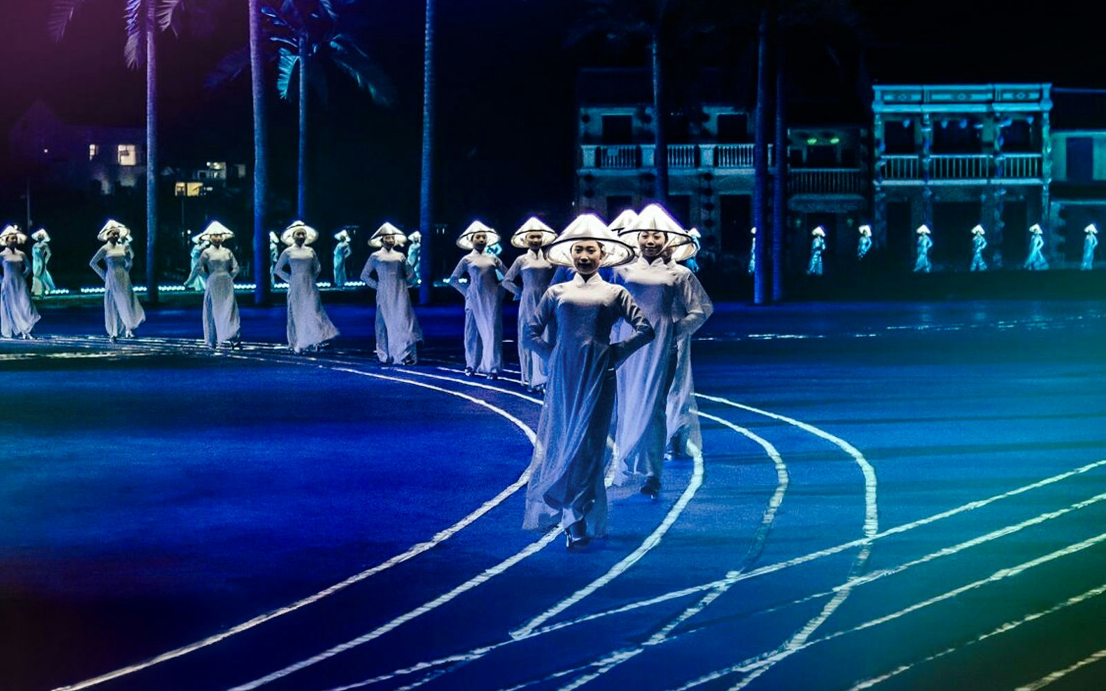 Performers in traditional attire at Hoi An Memories Show, Vietnam.