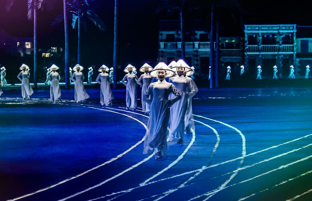 Performers in traditional attire at Hoi An Memories Show, Vietnam.