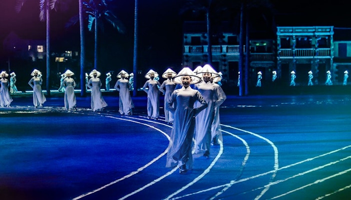Performers in traditional attire at Hoi An Memories Show, Vietnam.