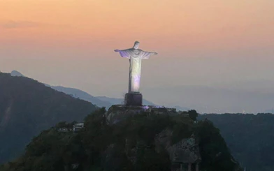 Christ the Redeemer statue at sunset during helicopter tour in Rio de Janeiro.