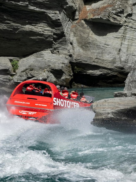 Shotover Jet navigating through narrow canyon waters.