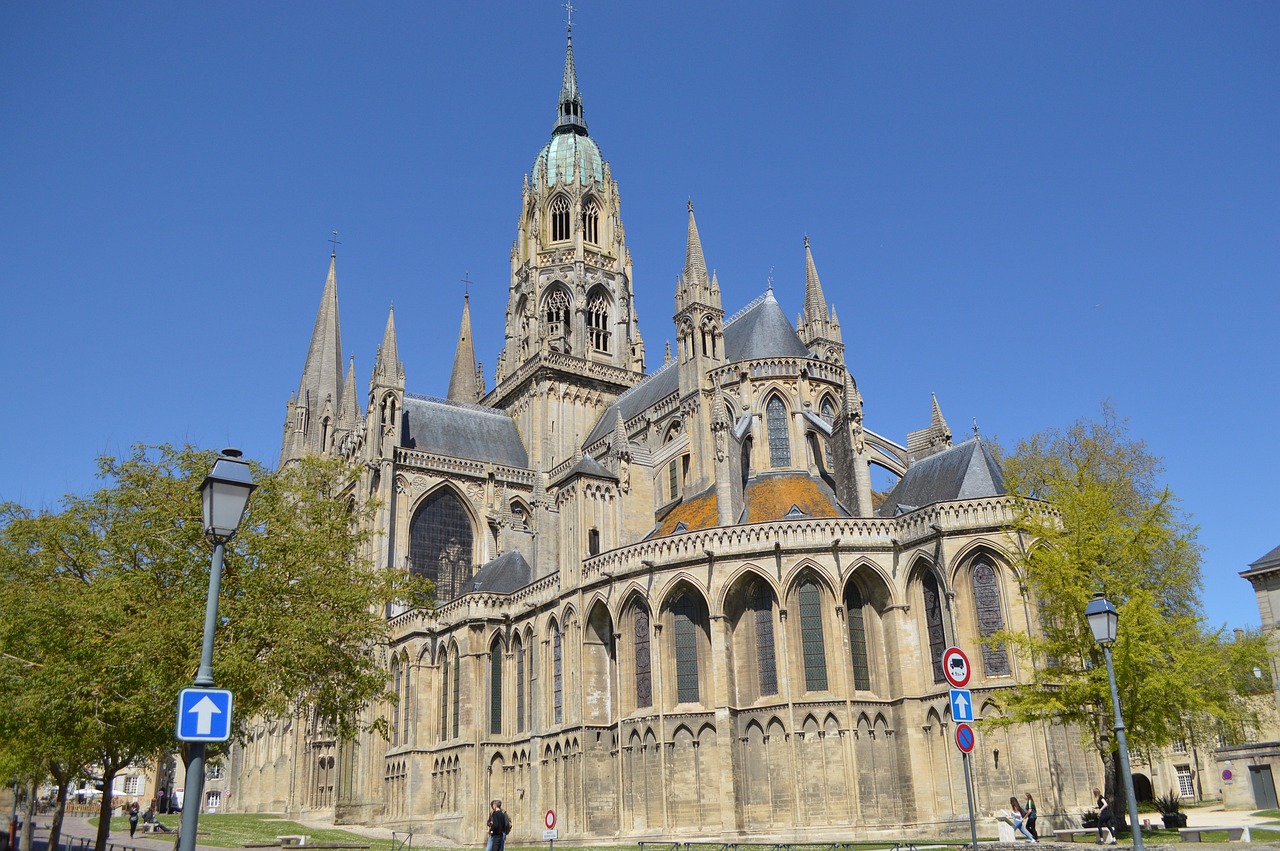 Bayeux Cathedral in Normandy with intricate Gothic architecture and towering spires.