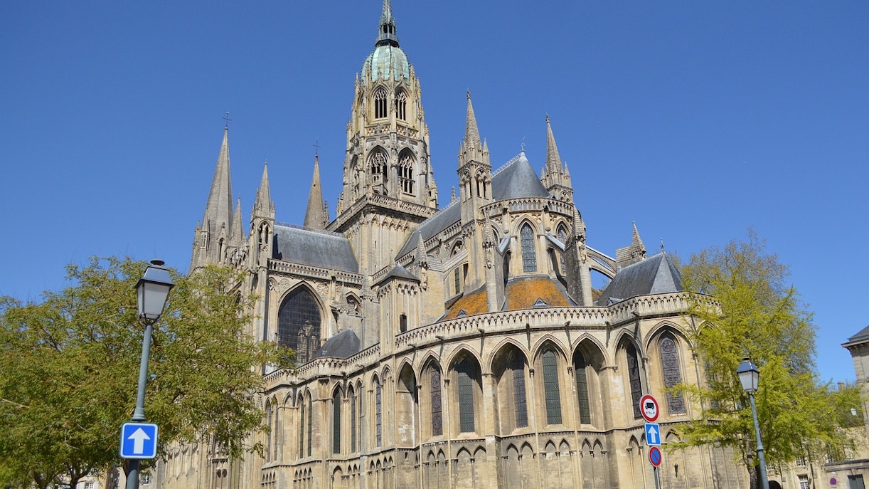 Bayeux Cathedral in Normandy with intricate Gothic architecture and towering spires.