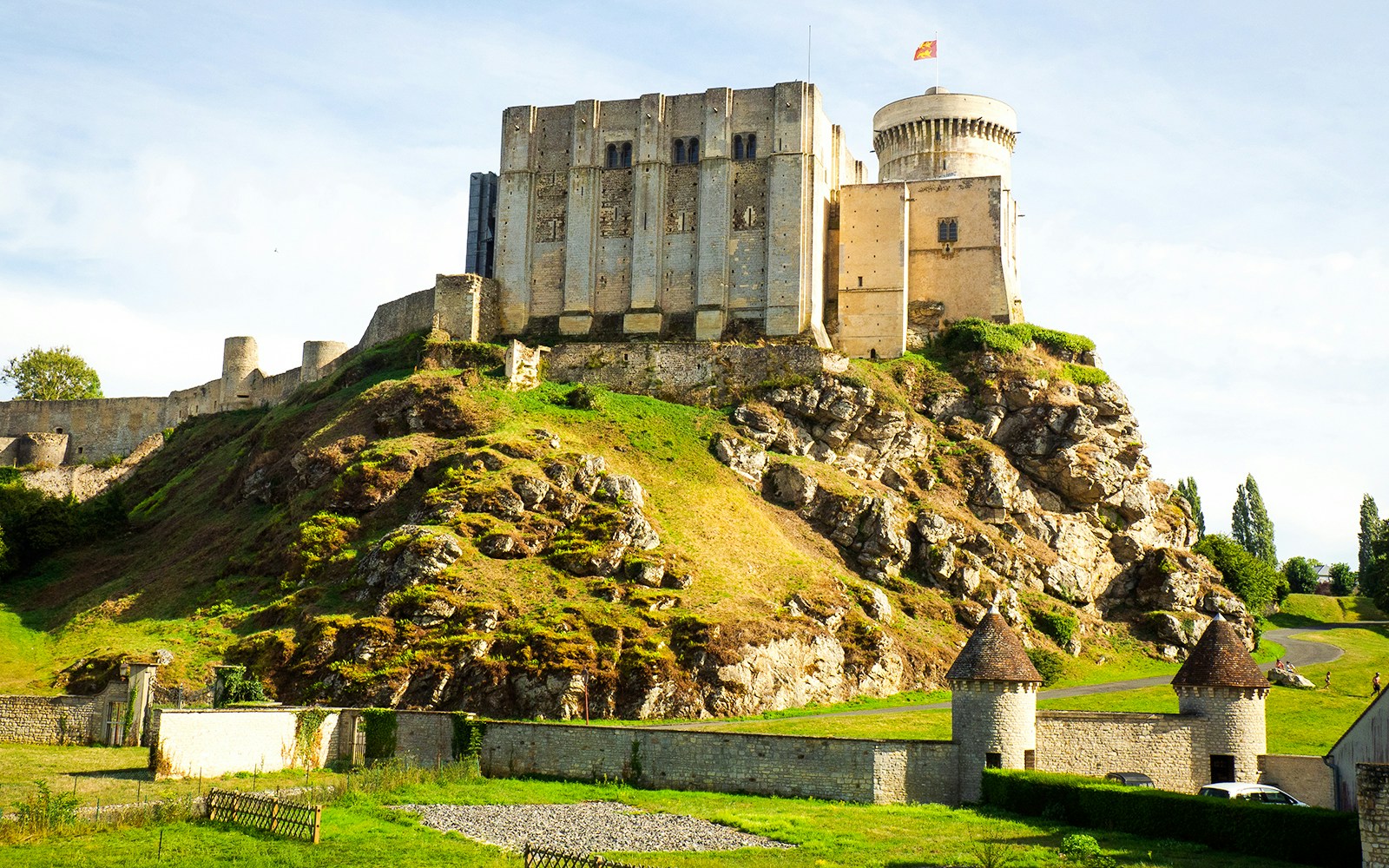 Château de Falaise on a rocky hill with medieval walls and towers in Normandy, France.