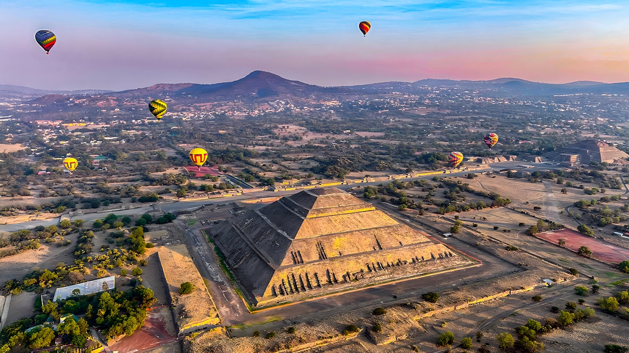 Hot air balloons over Pyramid of the Sun, Teotihuacan, Mexico.