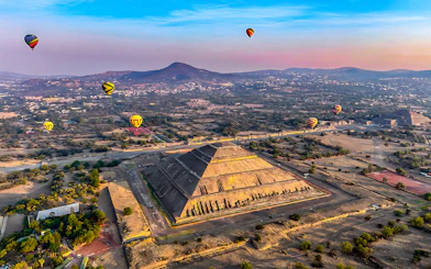Hot air balloons over Pyramid of the Sun, Teotihuacan, Mexico.