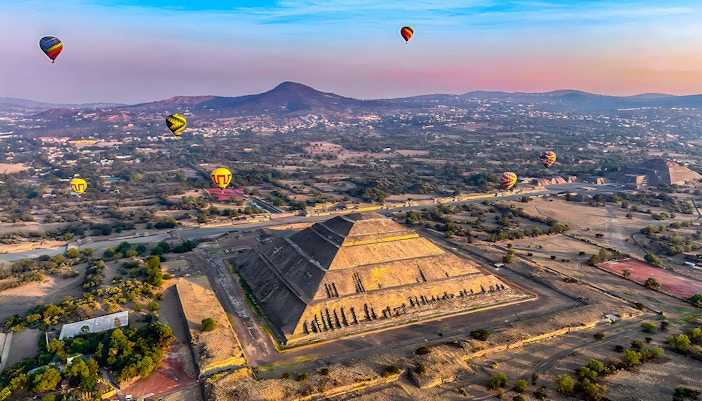 Hot air balloons over Pyramid of the Sun, Teotihuacan, Mexico.
