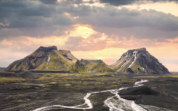 Katla volcano landscape with rugged mountains and river in Iceland.