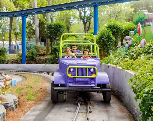 Dora-themed ride at Parque De Atracciones, featuring vibrant characters and interactive elements.