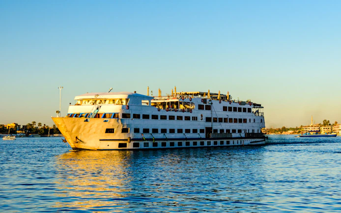 Cruise ship sailing on the Nile River in Luxor, Egypt.