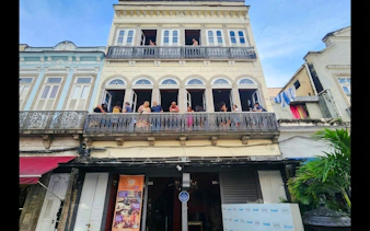 Facade of Rio Scenarium with people on the balcony, Rio de Janeiro.