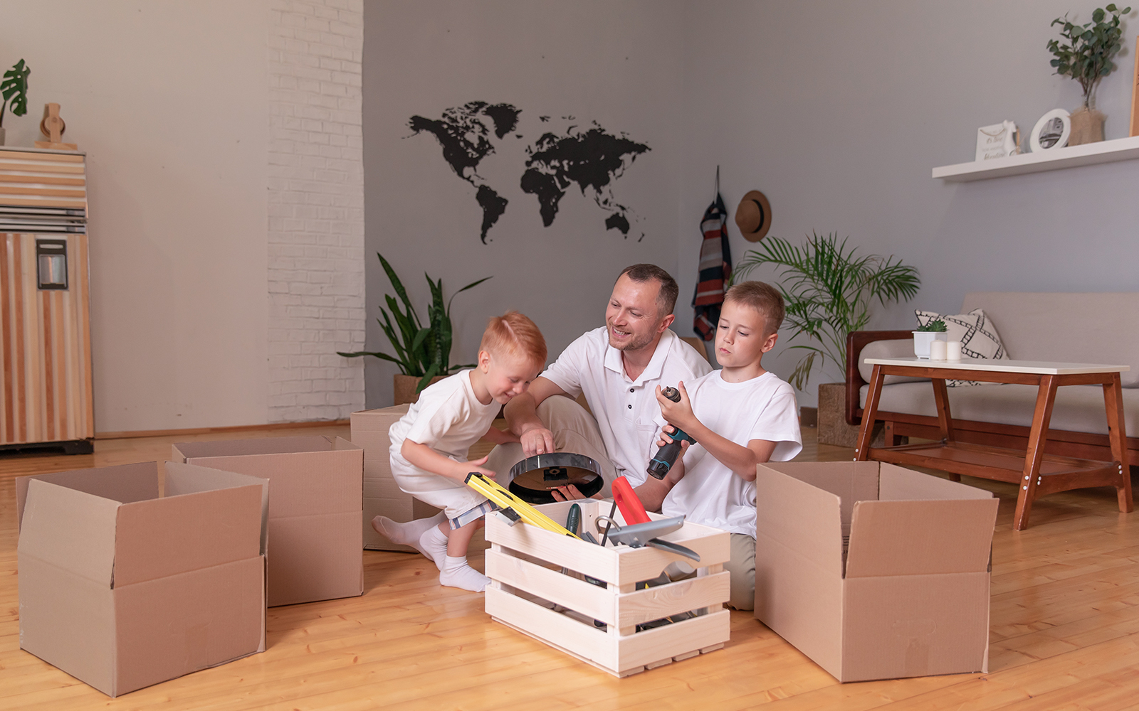 Father playing with his sons in a timber floored lodge