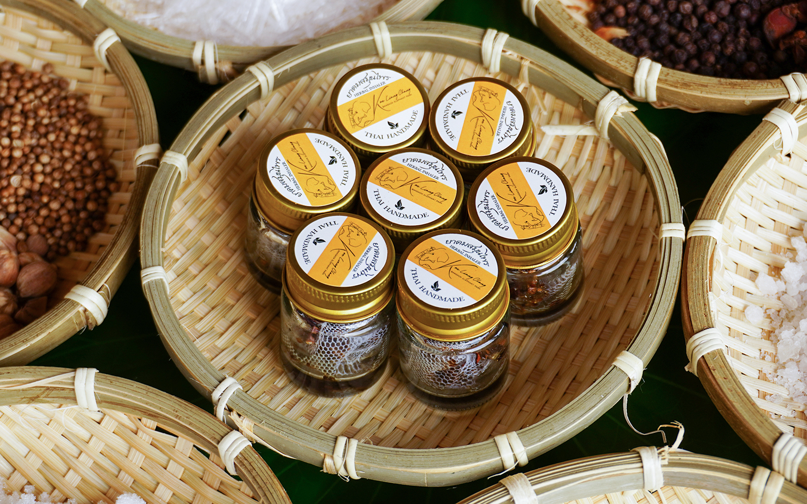 Jars of Thai handmade spices in bamboo baskets at Bangkok Elephant Park.