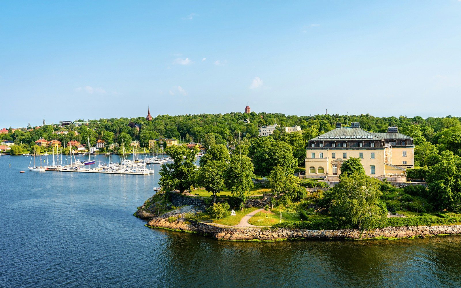Djurgrden City Canal Cruise boat navigating Djurgarden island waterways, Stockholm.
