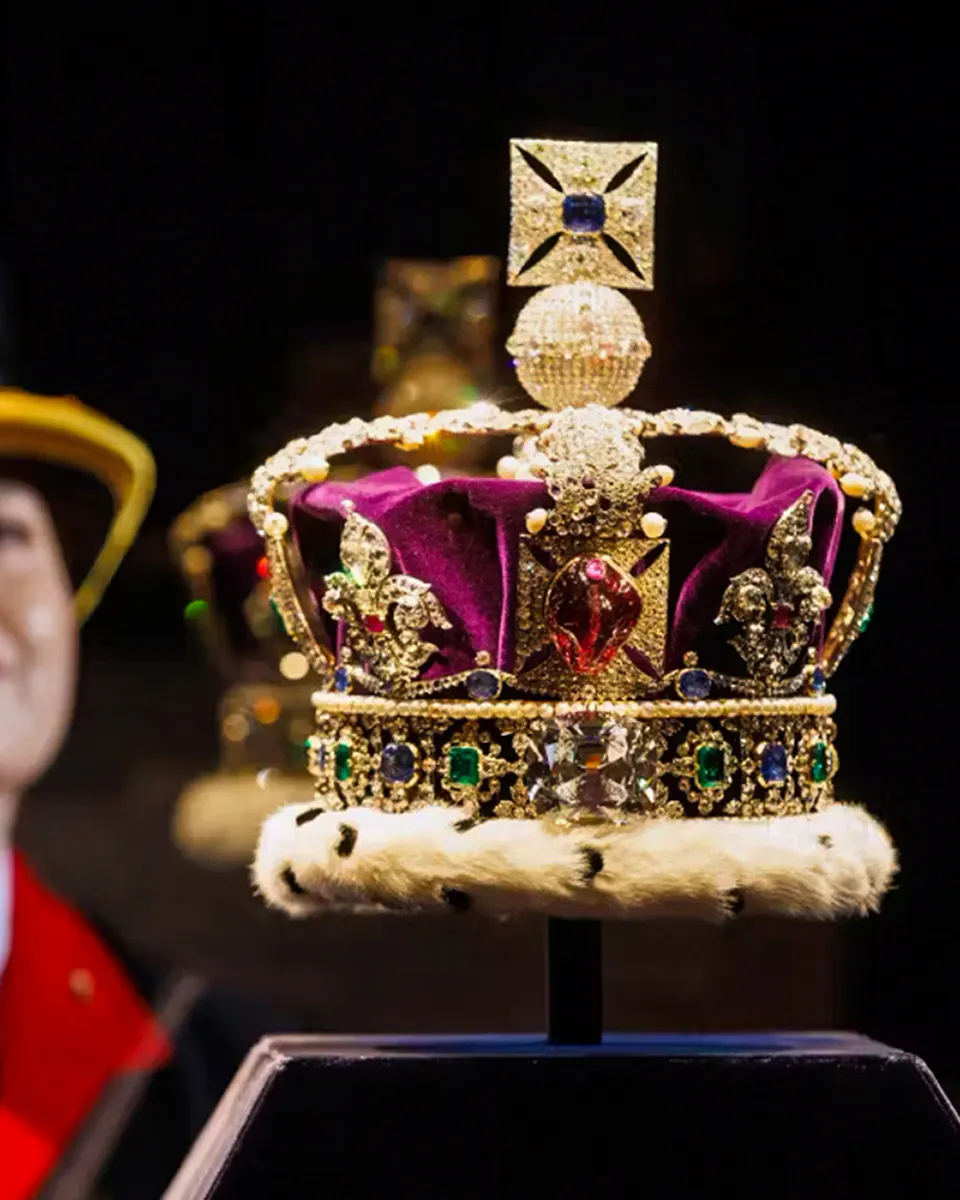 Crown jewels display at Tower of London featuring a bejeweled crown.