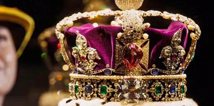 Crown jewels display at Tower of London featuring a bejeweled crown.