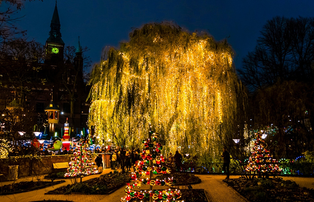 Tivoli Gardens in Copenhagen illuminated with Christmas lights and decorations.