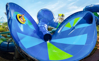 Raft on Ray Rush slide at Aquatica Orlando with riders enjoying the water attraction.