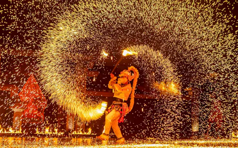 Performer in Ramayana Ballet, Yogyakarta, Indonesia, using pyrotechnics.