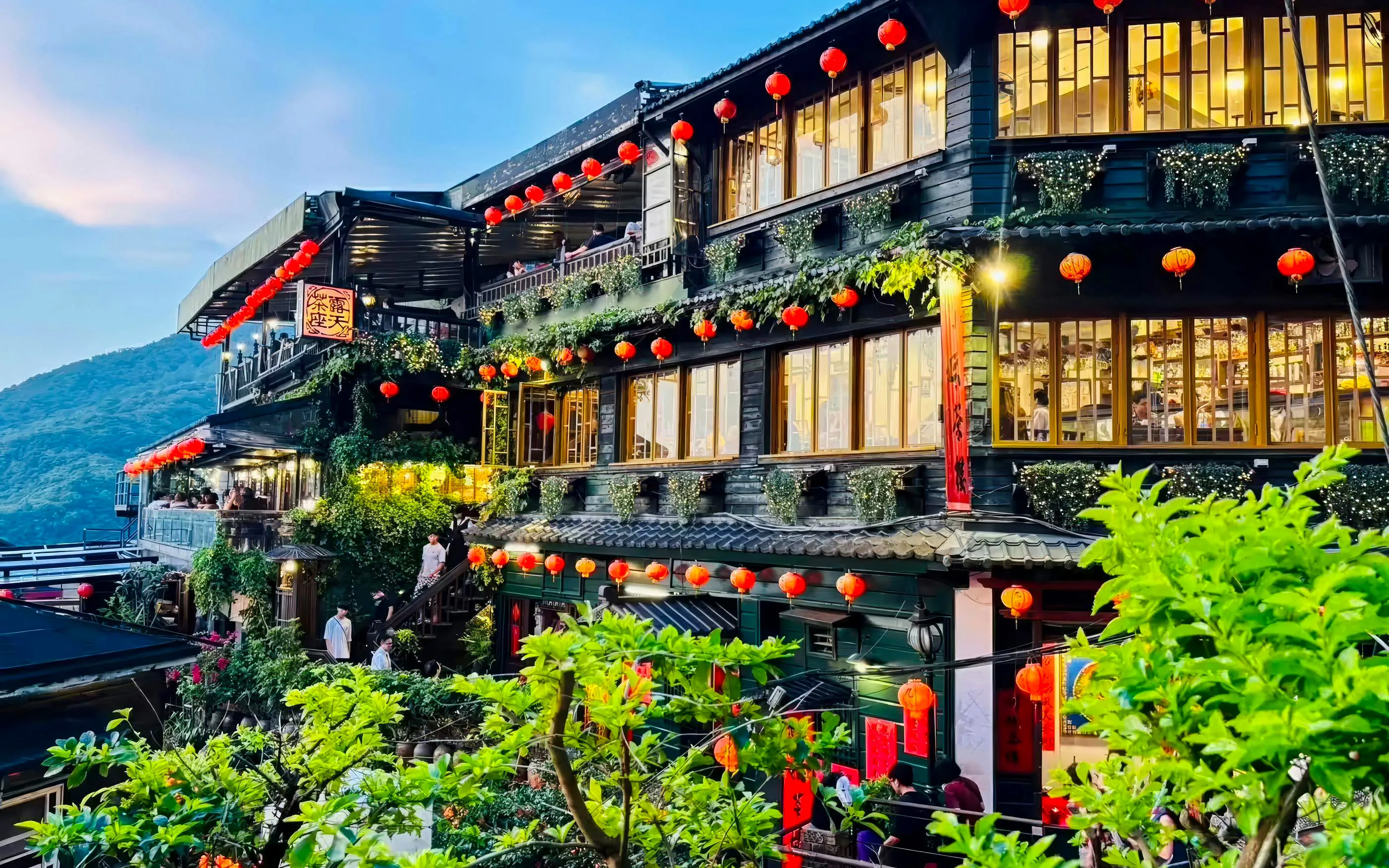 A-Mei Tea House adorned with red lanterns in Jiufen Old Street, New Taipei City, Taiwan.