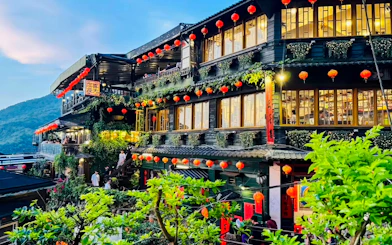 A-Mei Tea House adorned with red lanterns in Jiufen Old Street, New Taipei City, Taiwan.