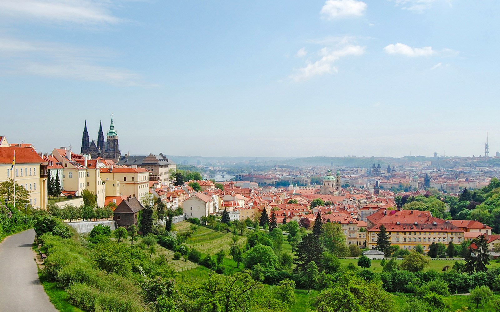 Panoramic view of Prague cityscape with St. Vitus Cathedral, seen from Beroun Hills, Czech Republic.