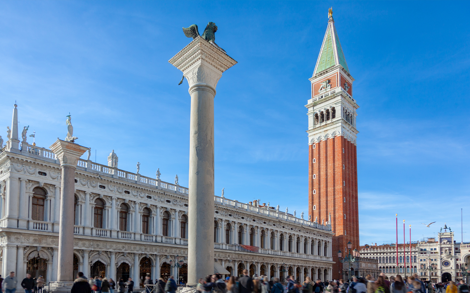 Campanile tower in San Marco Square, Venice, with surrounding historic architecture.