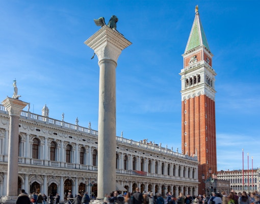 Campanile tower in San Marco Square, Venice, with surrounding historic architecture.