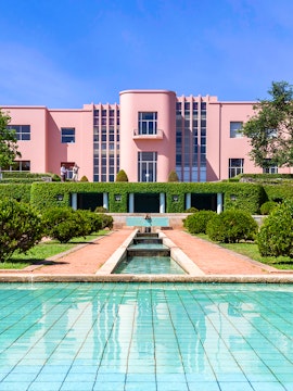 Modern pink art deco building with reflecting pool at Serralves Park, Porto.
