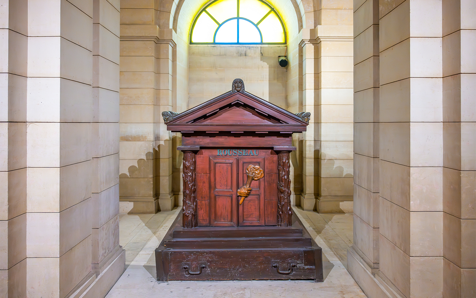 Tomb of Rousseau in the Paris Pantheon, featuring ornate carvings and classical architecture.