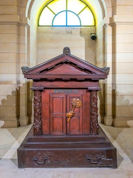 Tomb of Rousseau in the Paris Pantheon, featuring ornate carvings and classical architecture.