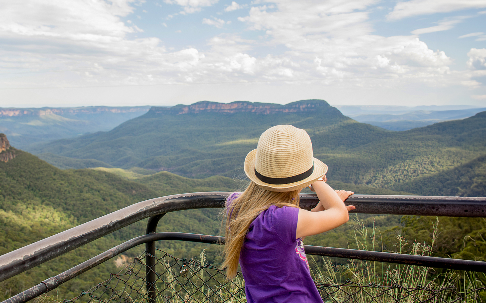 Child overlooking Jamison Valley from a viewpoint in Blue Mountains, Australia.