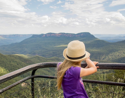 Child overlooking Jamison Valley from a viewpoint in Blue Mountains, Australia.