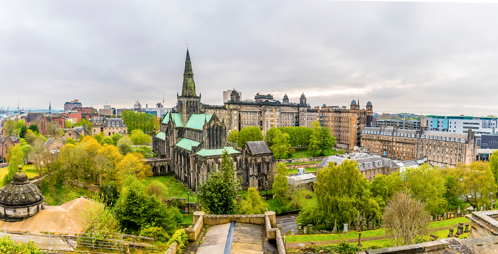 Glasgow Cathedral viewed from the Necropolis in Glasgow City, Scotland, with surrounding greenery.