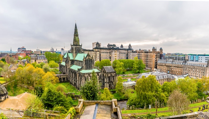 Glasgow Cathedral viewed from the Necropolis in Glasgow City, Scotland, with surrounding greenery.