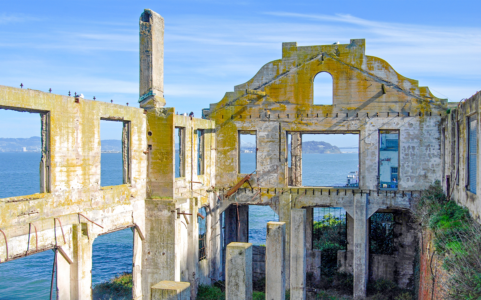Alcatraz Island Officers' Club historic building exterior with weathered facade and barred windows.