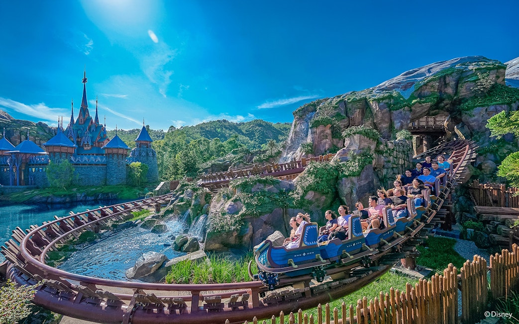 Roller coaster near Frozen Ever After castle at Disneyland Hong Kong.