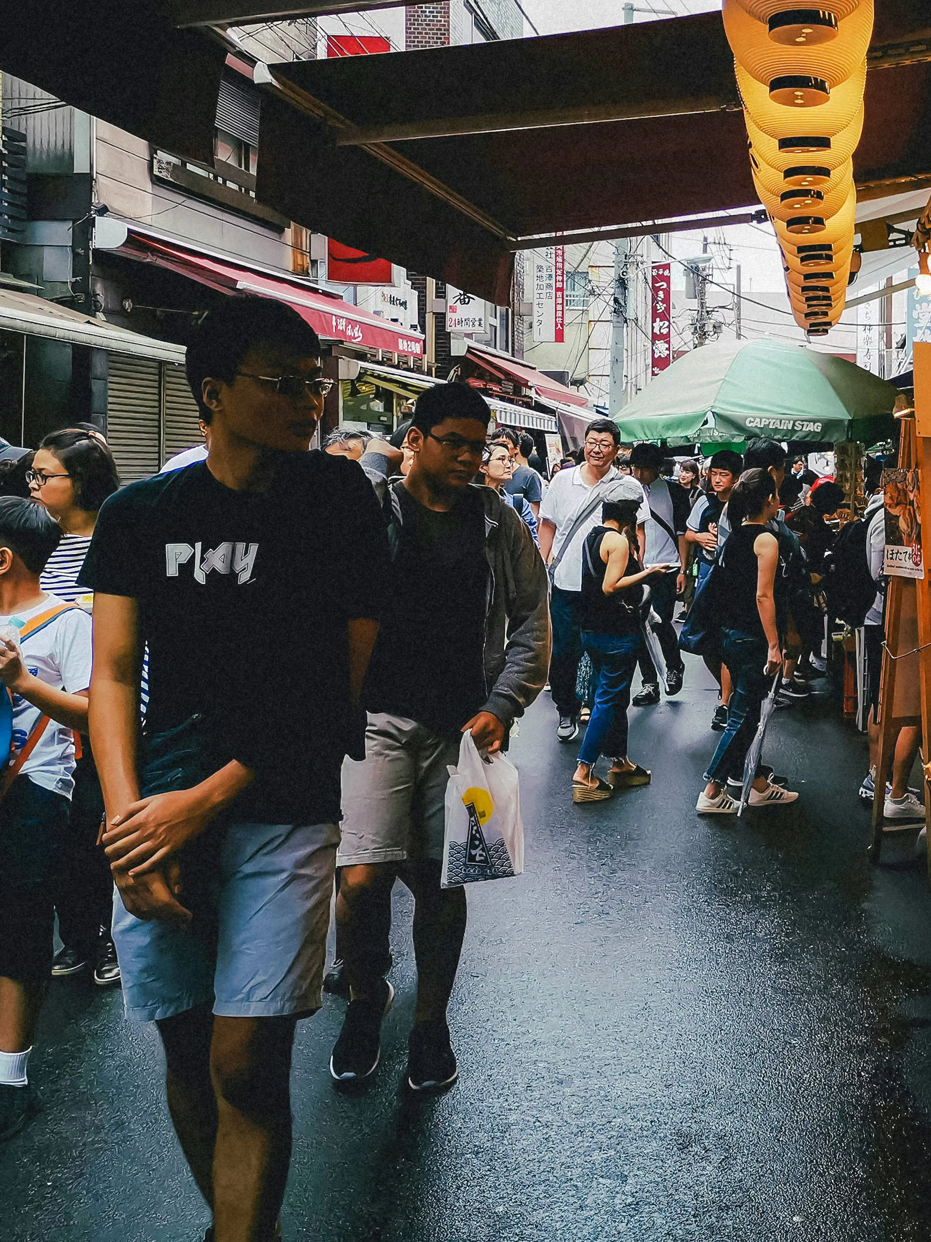 Street food market bustling with people during Tokyo Night Tour.