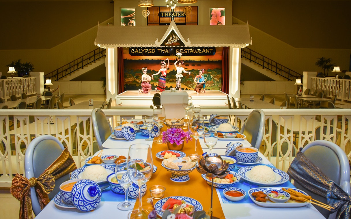 Thai set dinner with traditional performers on stage at Calypso cabaret, Bangkok.