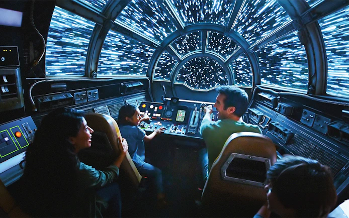 Guests enjoying Star Wars Galaxy's Edge spaceship ride at Disneyland Adventure Park, California.