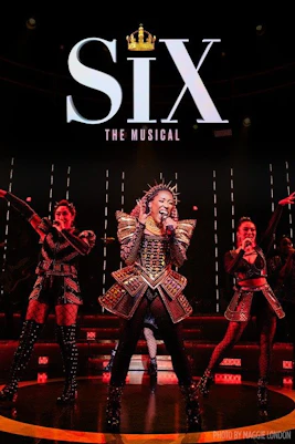 Performers on stage in SIX Broadway musical with vibrant costumes and lighting.