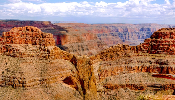 Helicopter flying over Grand Canyon West with view of Eagle Point, USA.
