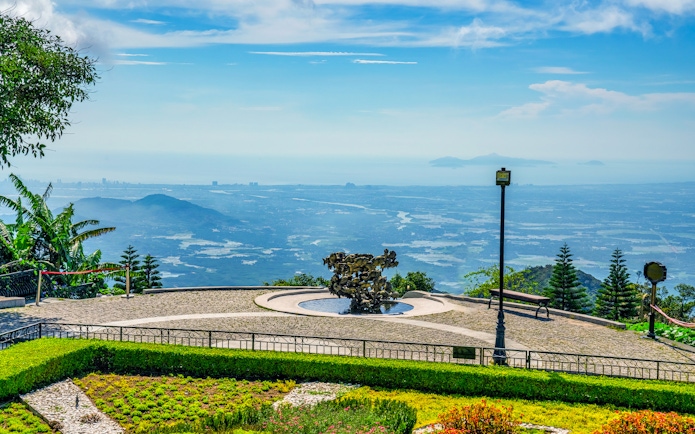 Sun World Ba Na Hills view with sculpture and distant landscape from cable car station.