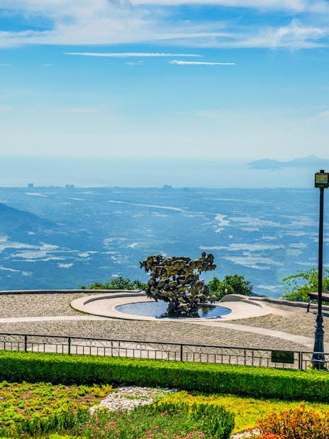 Sun World Ba Na Hills view with sculpture and distant landscape from cable car station.